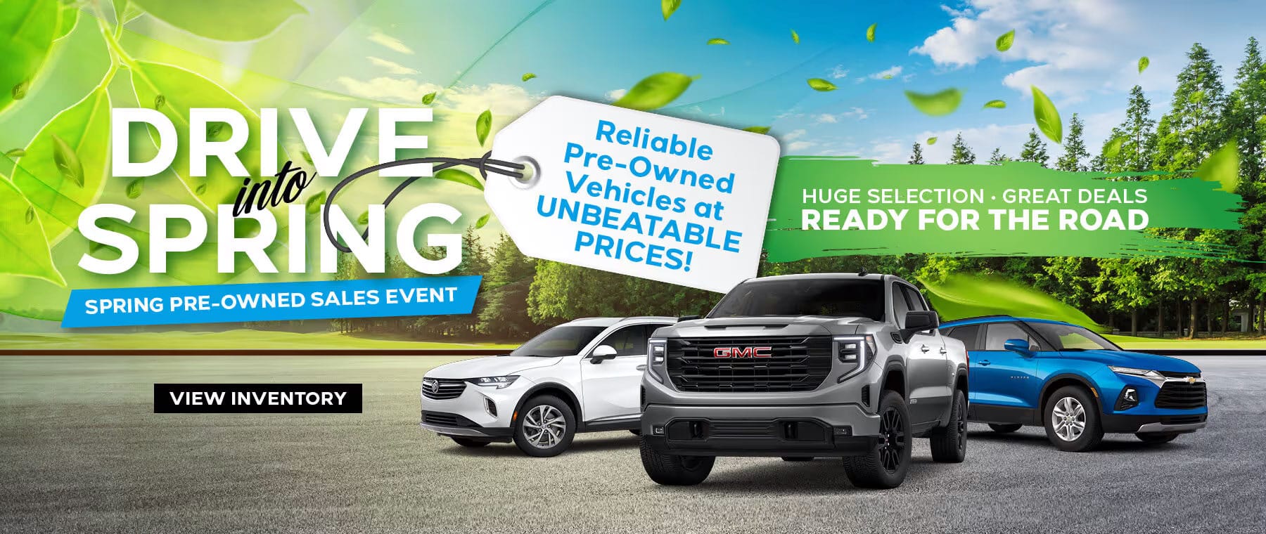 Advertisement for a car sales event titled Drive into Spring featuring three vehicles on a road, with trees and leaves in the background. A sign highlights Great Inventory Available Now! Starting at just $19,921. Button reads View Inventory.