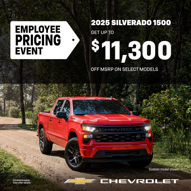 Red 2025 Chevrolet Silverado 1500 truck in forest. Employee pricing event with up to $11,300 off MSRP.