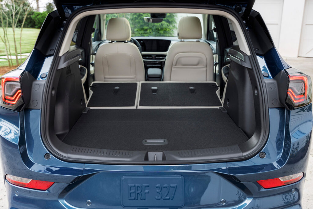 SUV interior with rear seats folded flat, showcasing ample cargo space.